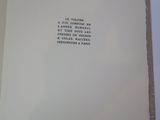 an open book with a poem on it on a table
