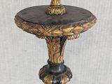 a close up of a wooden table with a black marble top