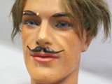 a mannequin head with a moustache on it