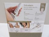 a box with a picture of a woman using a hair dryer