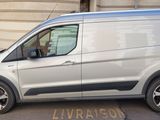 a silver van parked on the side of the street