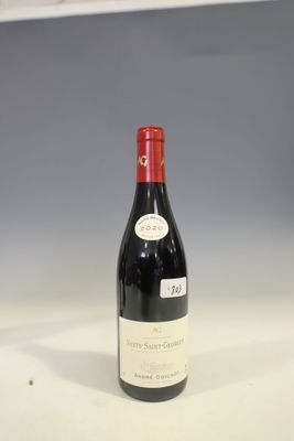 a bottle of wine that is sitting on a table