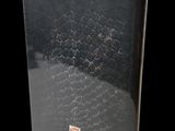 a close up of a book on a black surface