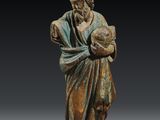 l'image d'une statue d'un homme tenant un bébé dans ses bras