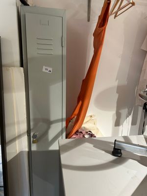 a bathroom with a sink and a shower in it