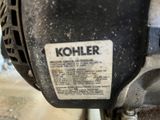 a close up of a kohler engine with a sticker on it
