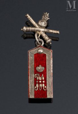 a silver and red medal with a bird on it