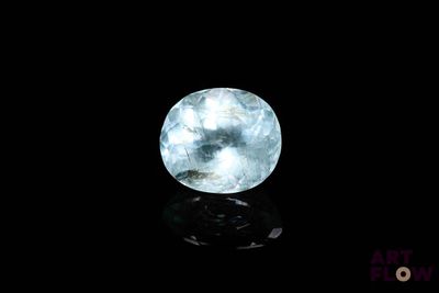 an image of a blue crystal ball on a black surface