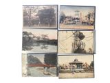 several old postcards of a park with people walking and riding horses