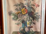 tableau représentant un vase de fleurs posé sur une table devant un mur rose