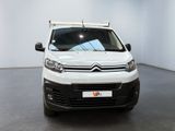 the white van is parked in a white room with a black floor