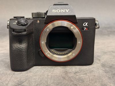 the camera is sitting on the table ready to be used