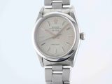an image of a silver watch with a white dial on a silver bracelet
