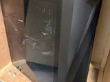 a black television sitting in a box on the floor