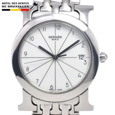 a close up of a watch on a white background