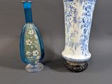 two vases sitting next to each other on a table