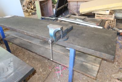 a picture of a workbench with a clamp on top of it