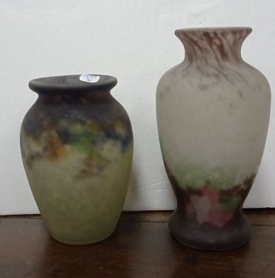 two vases that are sitting on a wooden table