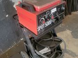 a small machine that is sitting on a cart
