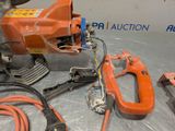 a machine that is sitting on the floor next to other tools