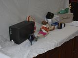 a table with a bunch of shoes and a box on it