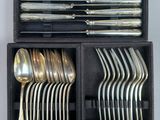 a lot of spoons and forks in a box