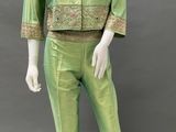 an image of a mannequin wearing a green suit and hat