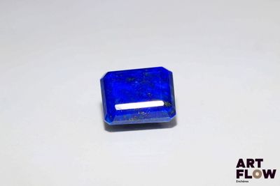 an image of a blue square shaped stone sitting on top of a white surface