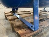 an image of a blue boat on a wooden pallet
