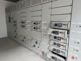 a room with a bunch of electrical equipment on the wall