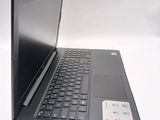 a laptop computer sitting on top of a white table