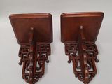 a pair of antique wooden bookends with carved handles