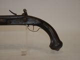 an old gun that is on display in a museum