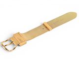 a close up of a gold watch strap on a white surface