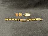 a close up of a gold bracelet and a gold chain
