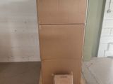 a cardboard box sitting on top of a pallet in a garage