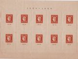 an old sheet of red stamps with portraits of people on them