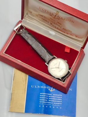 an image of a watch in a red box on a table