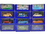 a lot of toy cars that are in a blue box