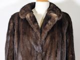 an image of a brown fur coat on a mannequin