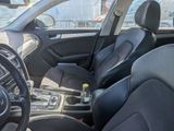 the interior of a car with black leather seats and a steering wheel