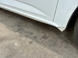 a close up of a white car with a flat tire