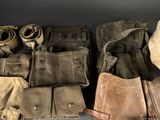 many different types of leather bags lined up together