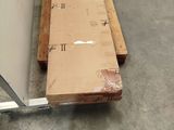 a box sitting on a pallet in a warehouse