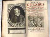 un vieux livre sur lequel figure l'image d'un homme vêtu d'une robe noire