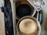 a box full of hats and other items on the floor