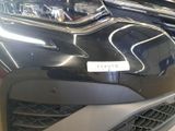 a close up of a car ' s front bumper with a sticker on it