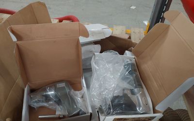 a box of assorted items sitting on top of a carton