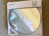 a box with a mirror inside of it on the floor