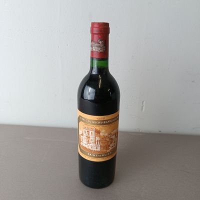 a bottle of wine that is sitting on a table